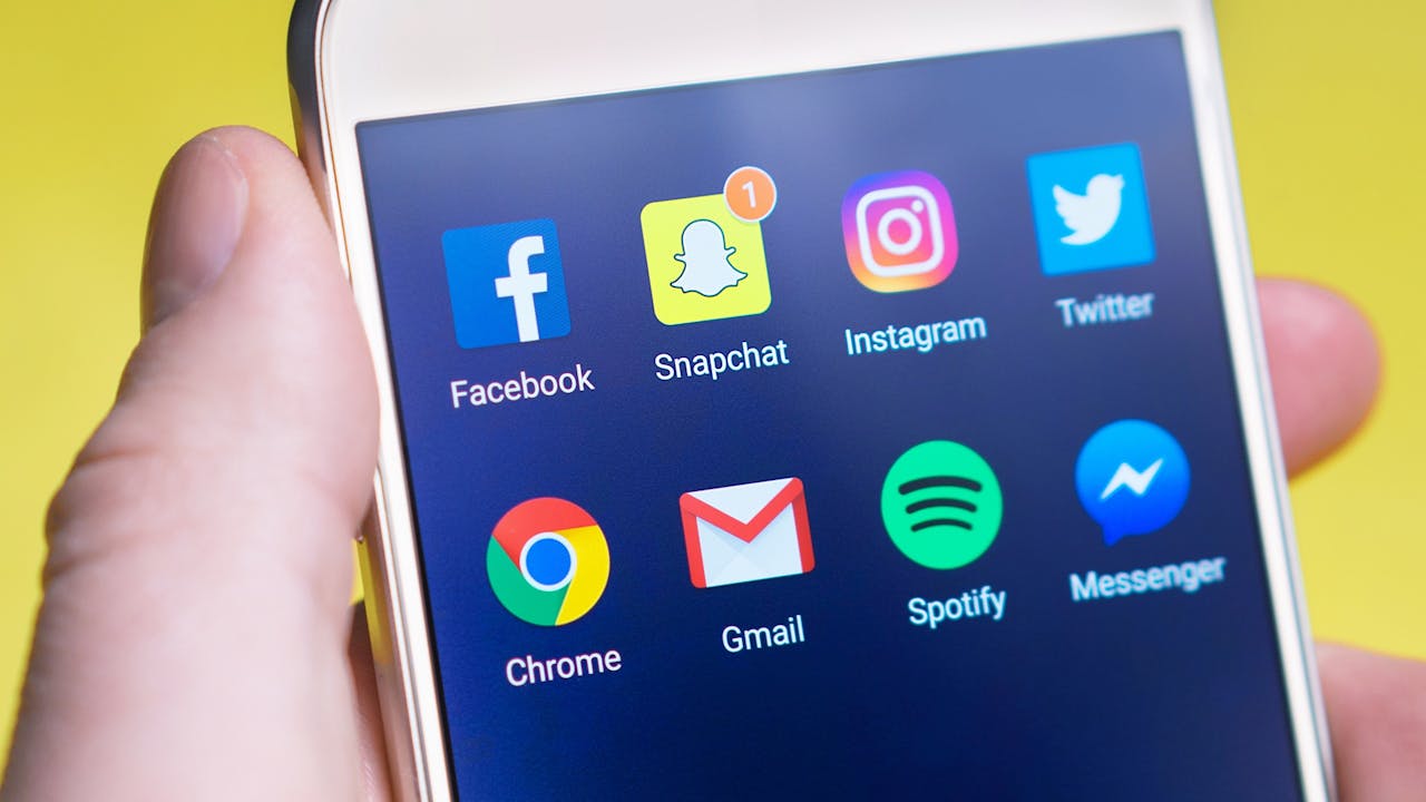 A social media folder on a smartphone’s screen.