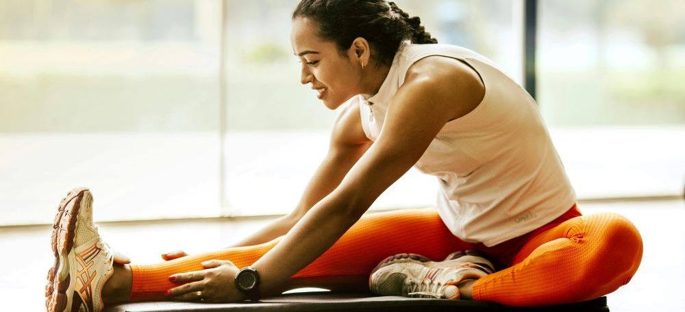 A woman working out and smiling